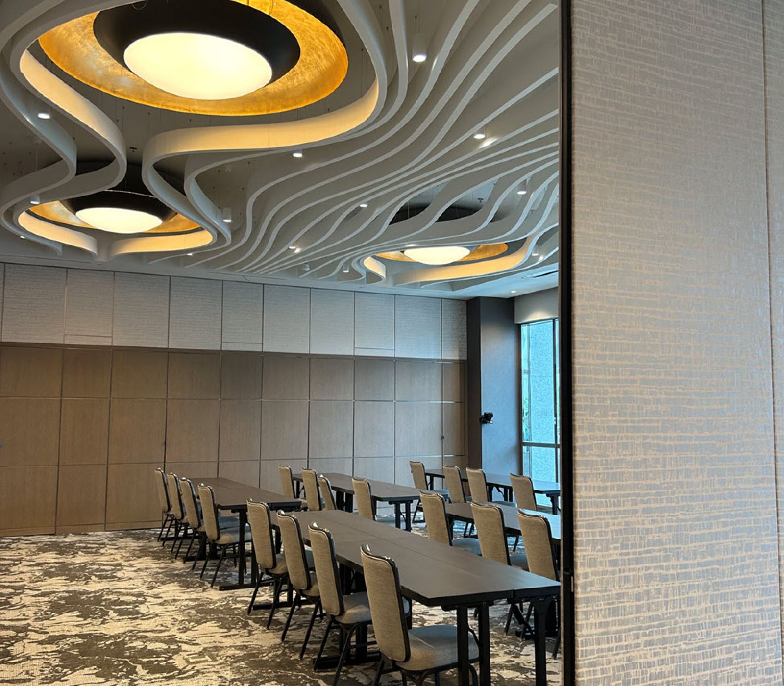 Conference room with sliding wall partially closed.
